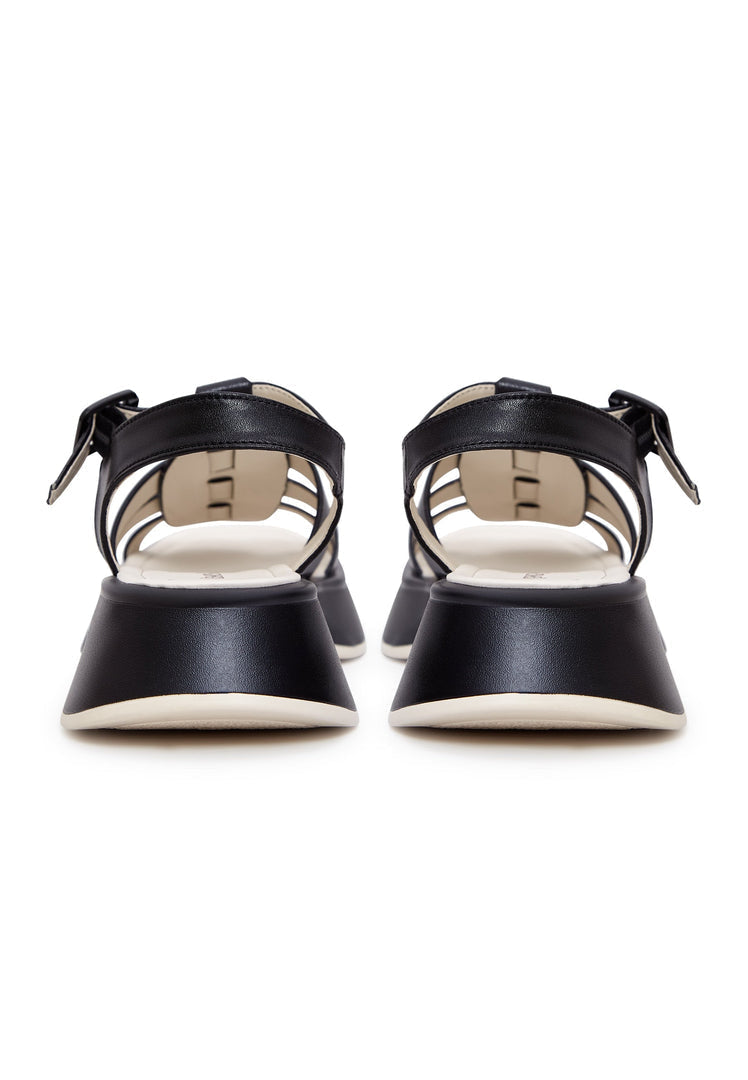 A sleek pair of high heel platform leather sandals in black, known as Joanna sandals for women.