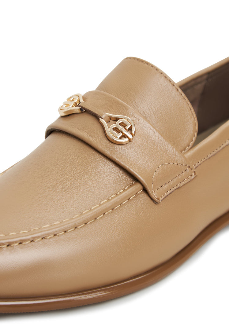A stylish pair of beige leather block heeled Abigail loafers, perfect for trendy and chic women's shoe collection.