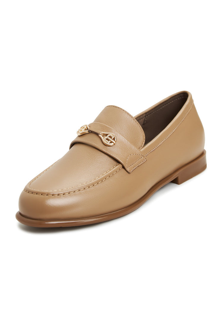 A stylish pair of women's leather block heeled loafers in beige, known as the Abigail loafers, perfect for those seeking trendy block heel comfort.