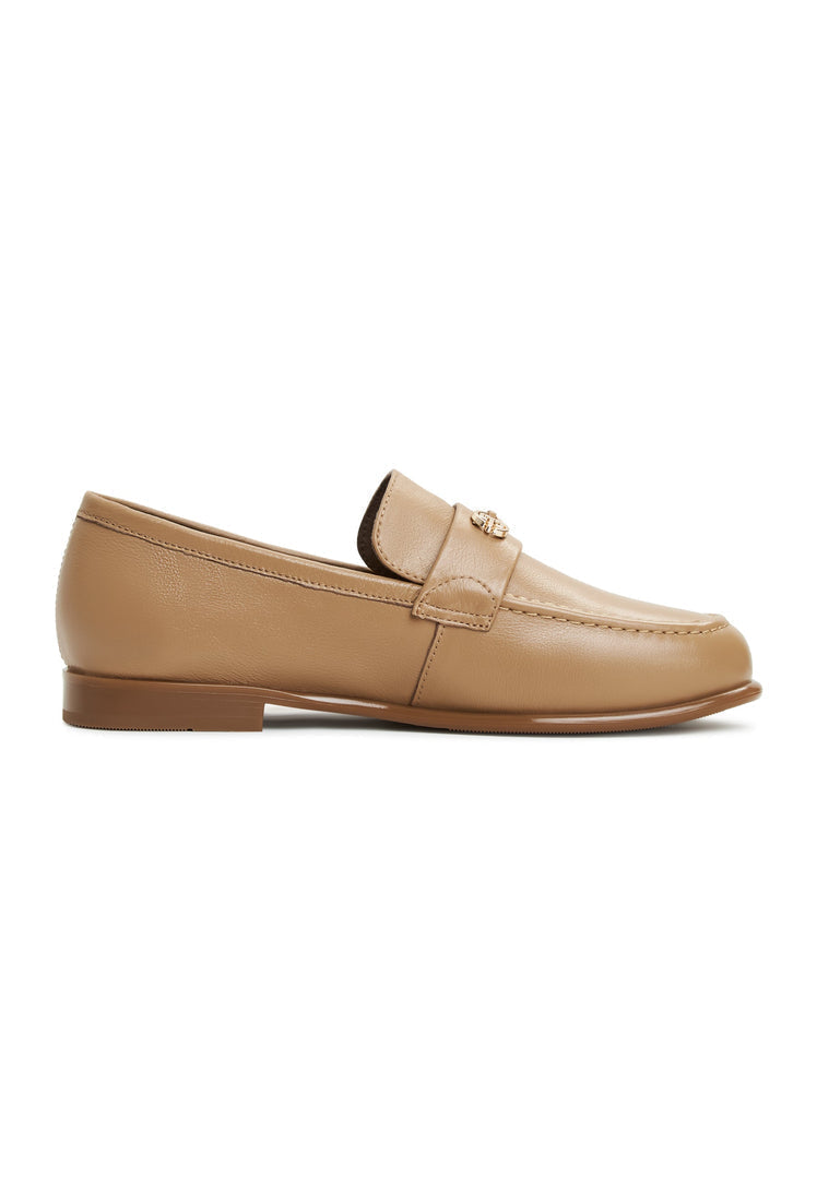 A pair of women's beige leather block heeled loafers, known as Abigail loafers, a trendy choice for stylish ladies.