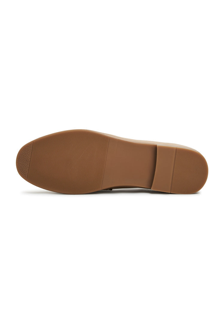 A trendy pair of women's leather block heeled loafers in beige, known as the Abigail loafers.