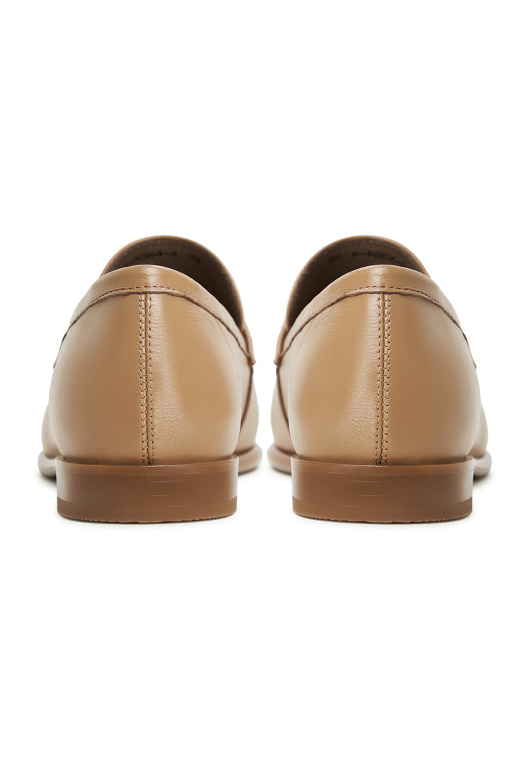 A stylish pair of women's beige leather block heeled loafers, known as Abigail loafers, the ideal choice for those looking for trendy block heel loafers.