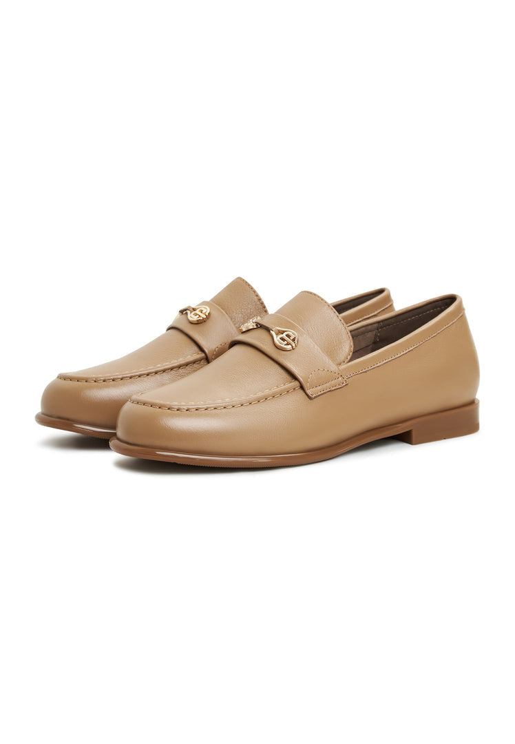 A close-up of trendy beige leather block heeled Abigail loafers, perfect for women's fashion.