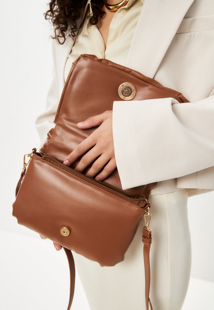 A stylish brown quilted clutch bag, a perfect accessory to elevate any outfit.