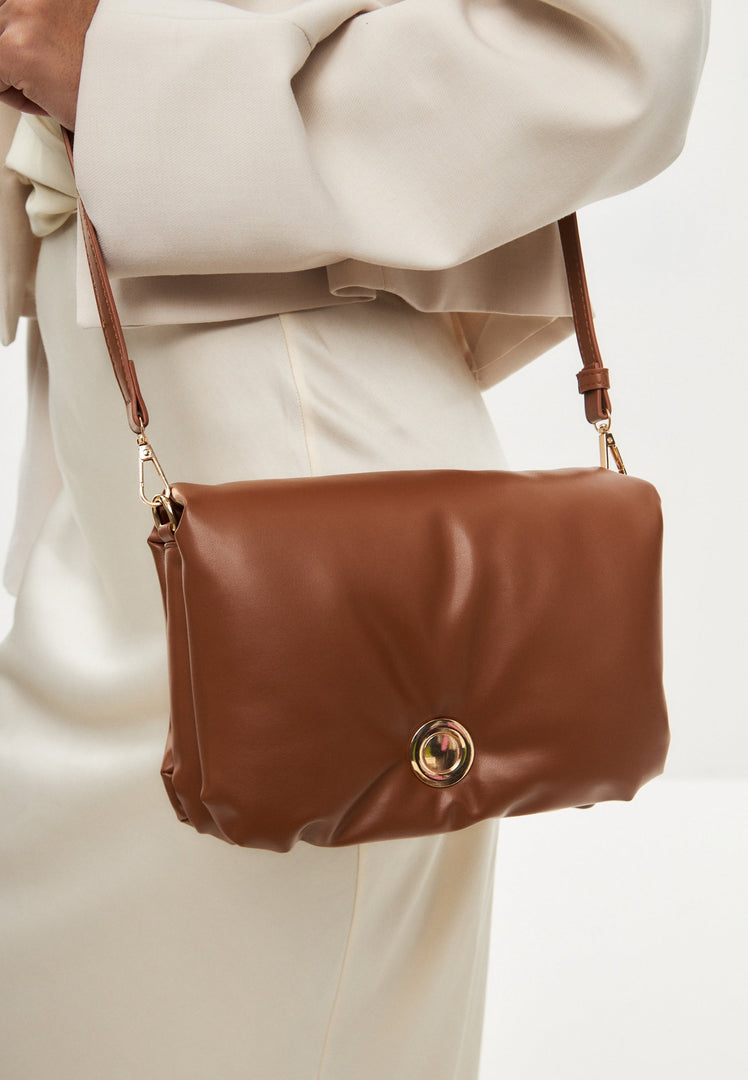 A stylish brown quilted clutch bag perfect for any outfit or occasion.
