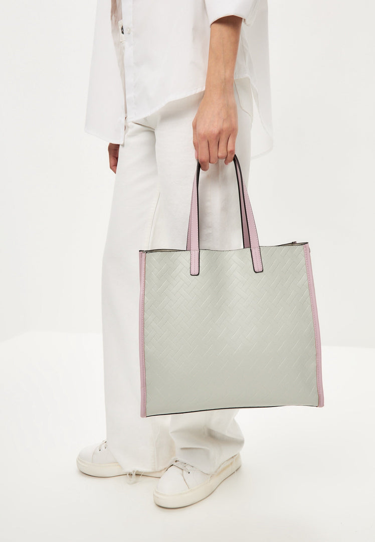 A stylish grey tote bag perfect for any outfit, great for carrying all your essentials.