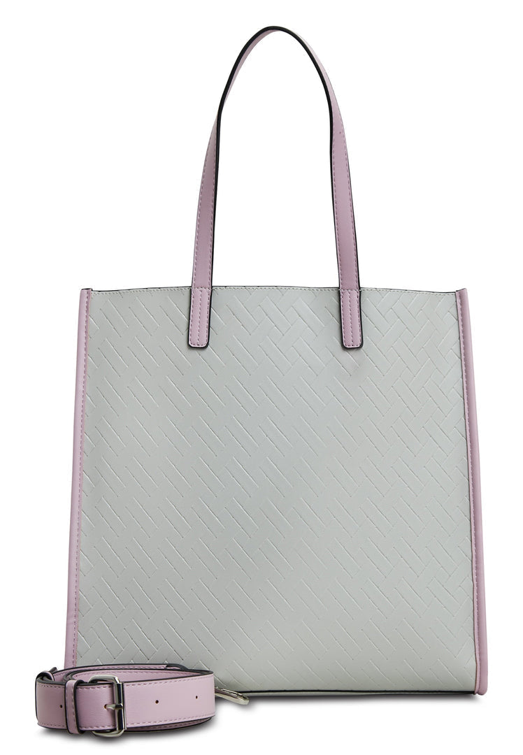 A woman's hand holding a stylish grey tote bag, perfect for everyday use and a fashionable accessory.