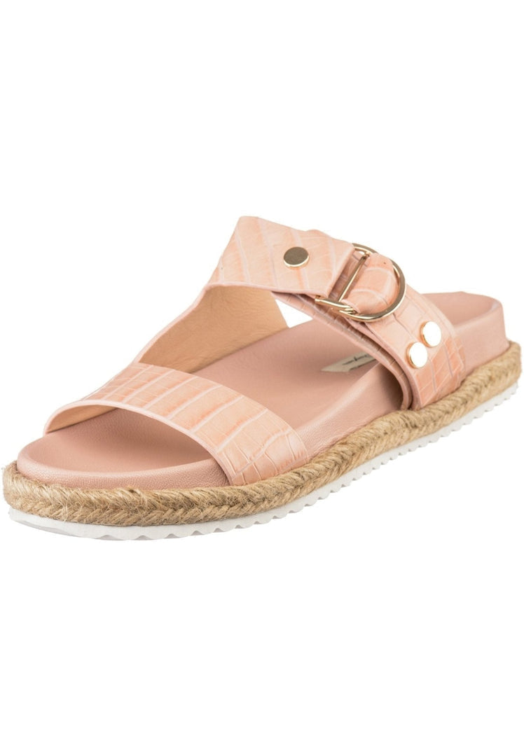 A pair of trendy beige buckle strap slide sandals for women representing summer fashion trends.
