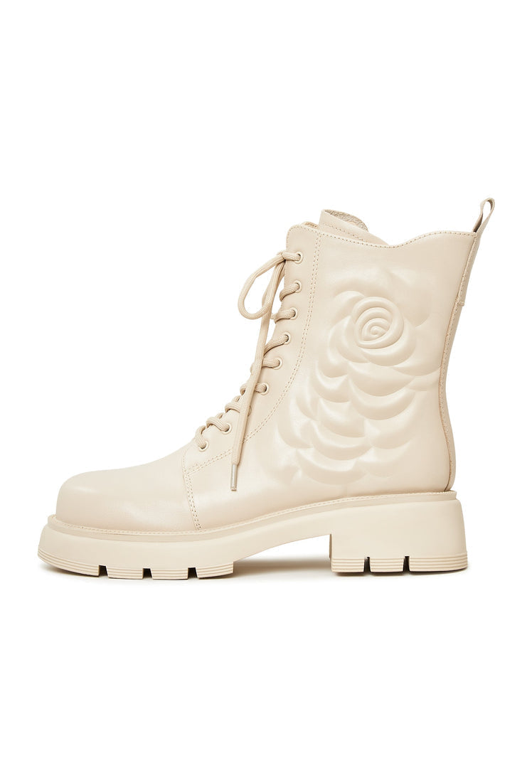 A stylish pair of leather platform ankle boots in ivory, perfect for a chic and fashionable look.