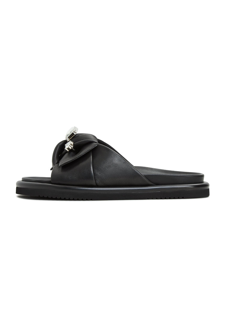 A stylish pair of black platform slippers, known as Fernanda slippers, perfect for women looking for trendy slide sandals or footbed sandals.