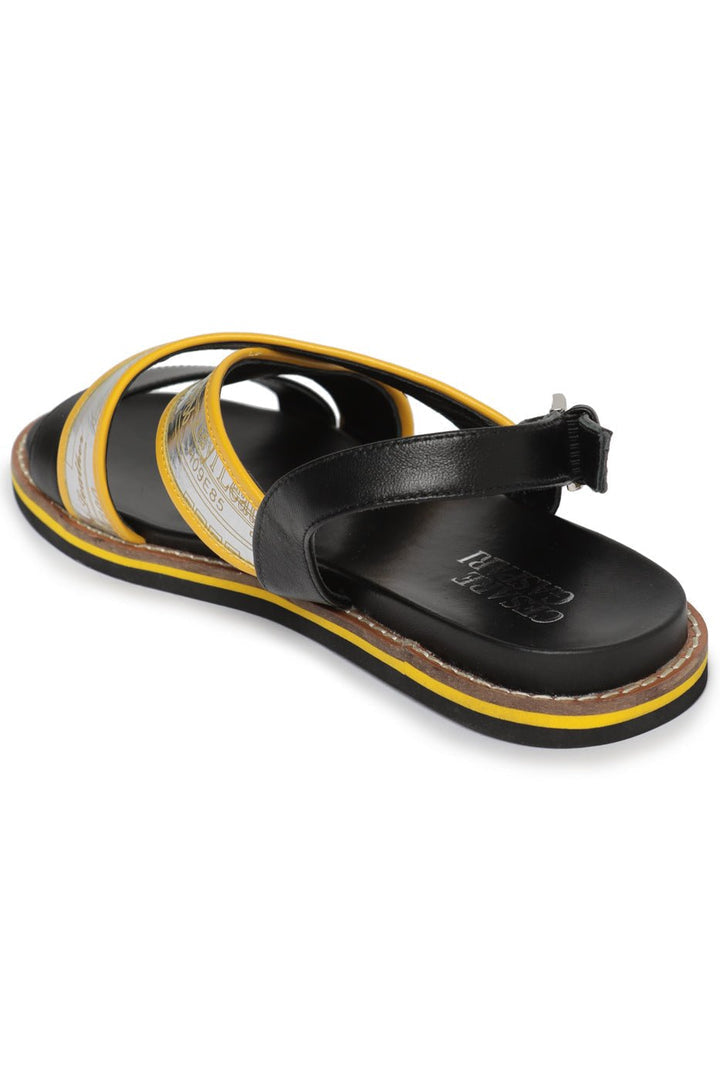 A pair of stylish urban leather sandals with flat soles, perfect for everyday wear.
