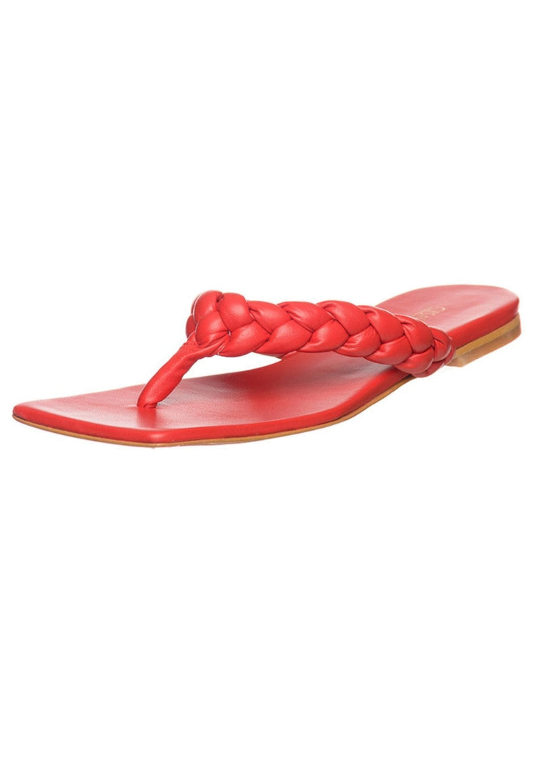 A stylish and trendy pair of red open toe sandals, perfect for a fashionable and chic look.