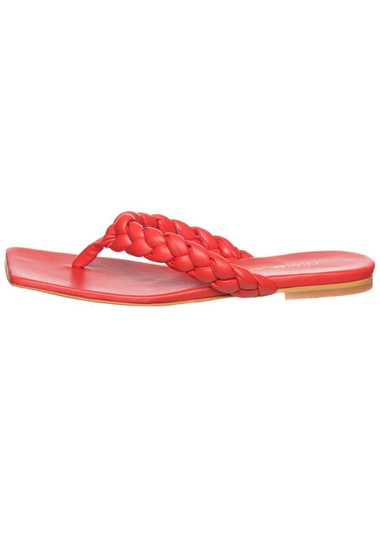 A pair of chic red open toe sandals, the perfect trendy and fashionable addition to any stylish outfit.
