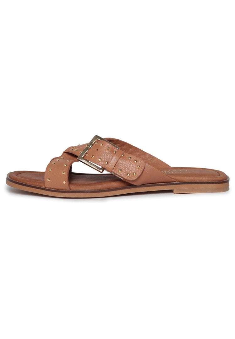 A pair of chic women's leather open toe sandals, perfect for summer, with an open tip design.