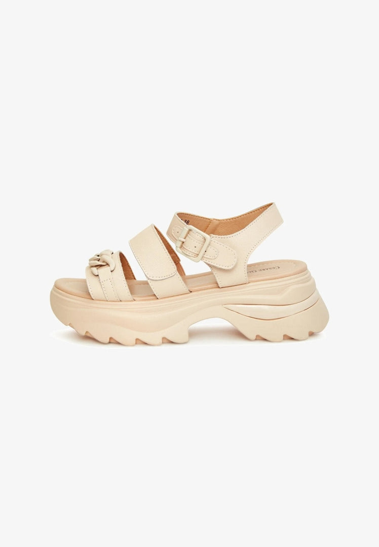 A stylish pair of women's leather platform sandals with high heels, perfect for elevating any outfit.