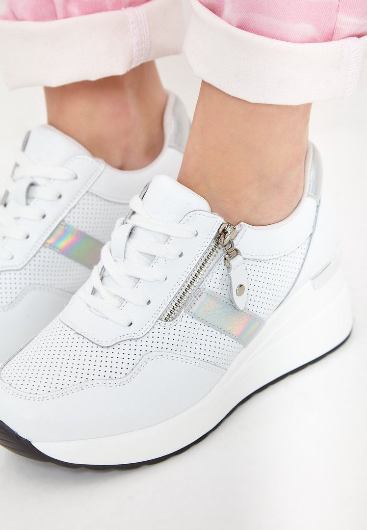 A stylish pair of white leather sneakers, perfect for a trendy and comfortable look.