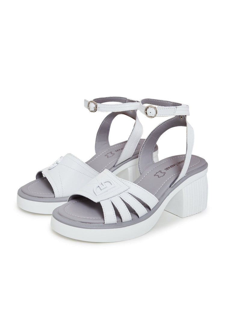 A close-up of chic women's open toe block heel sandals in a trendy neutral color.