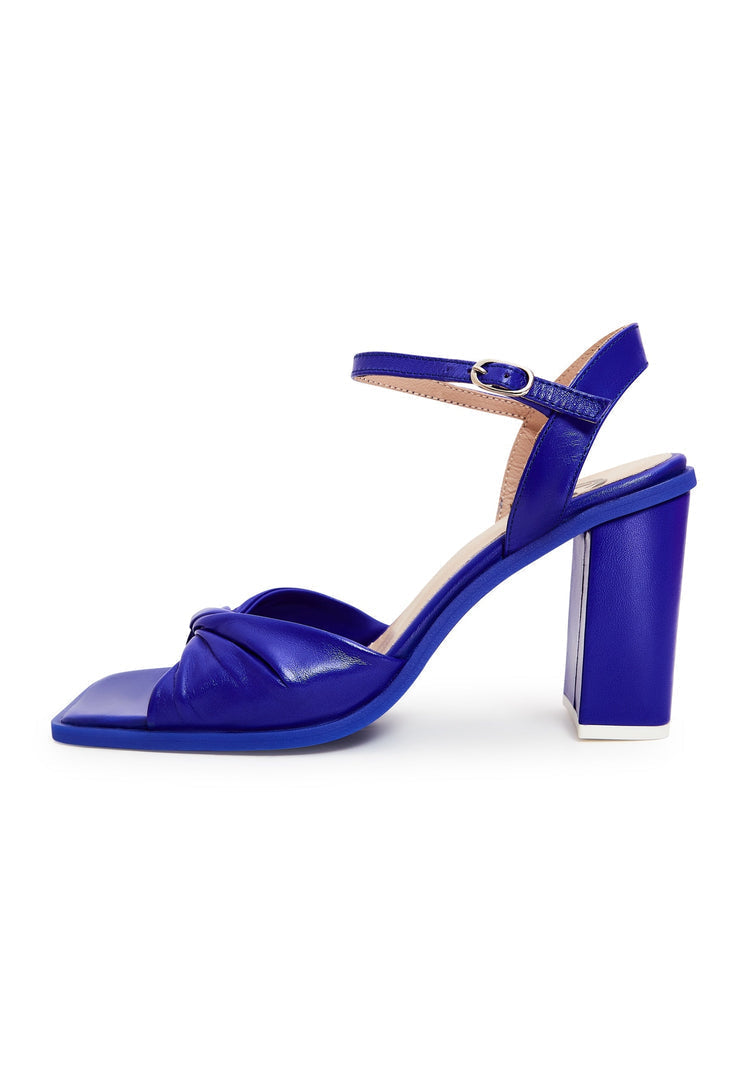 A pair of stylish blue block heels, a timeless and elegant choice for classic footwear lovers.