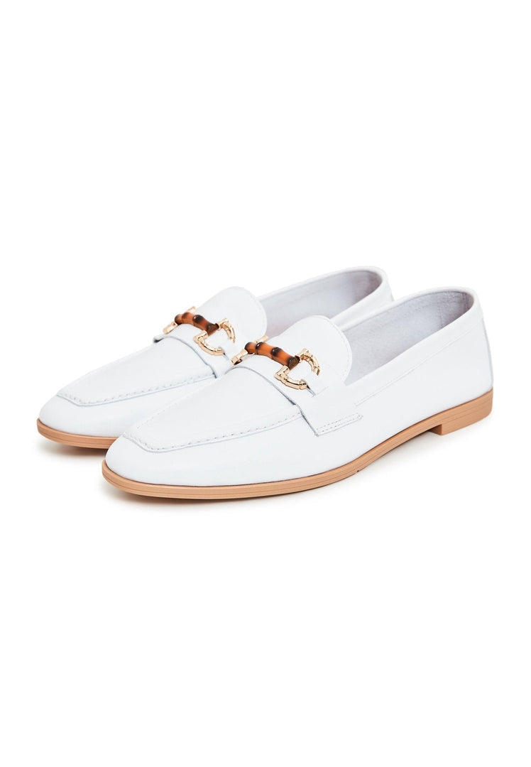 A pair of designer white leather loafers, high quality and stylish leather shoes.