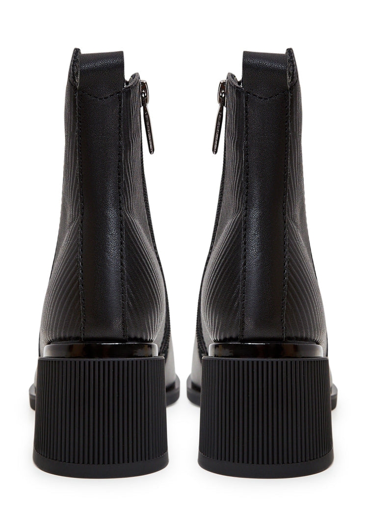 A pair of stylish and affordable women's black suede ankle boots, perfect for casual wear.