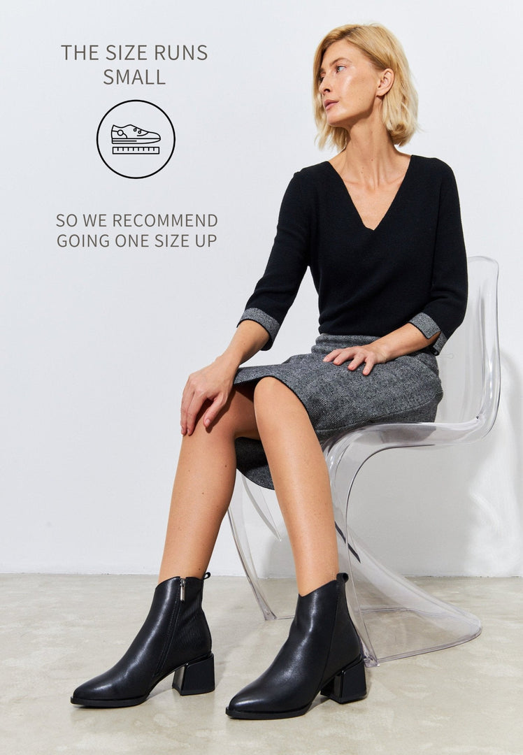 A pair of stylish black suede ankle boots for women, perfect for a casual and affordable look.