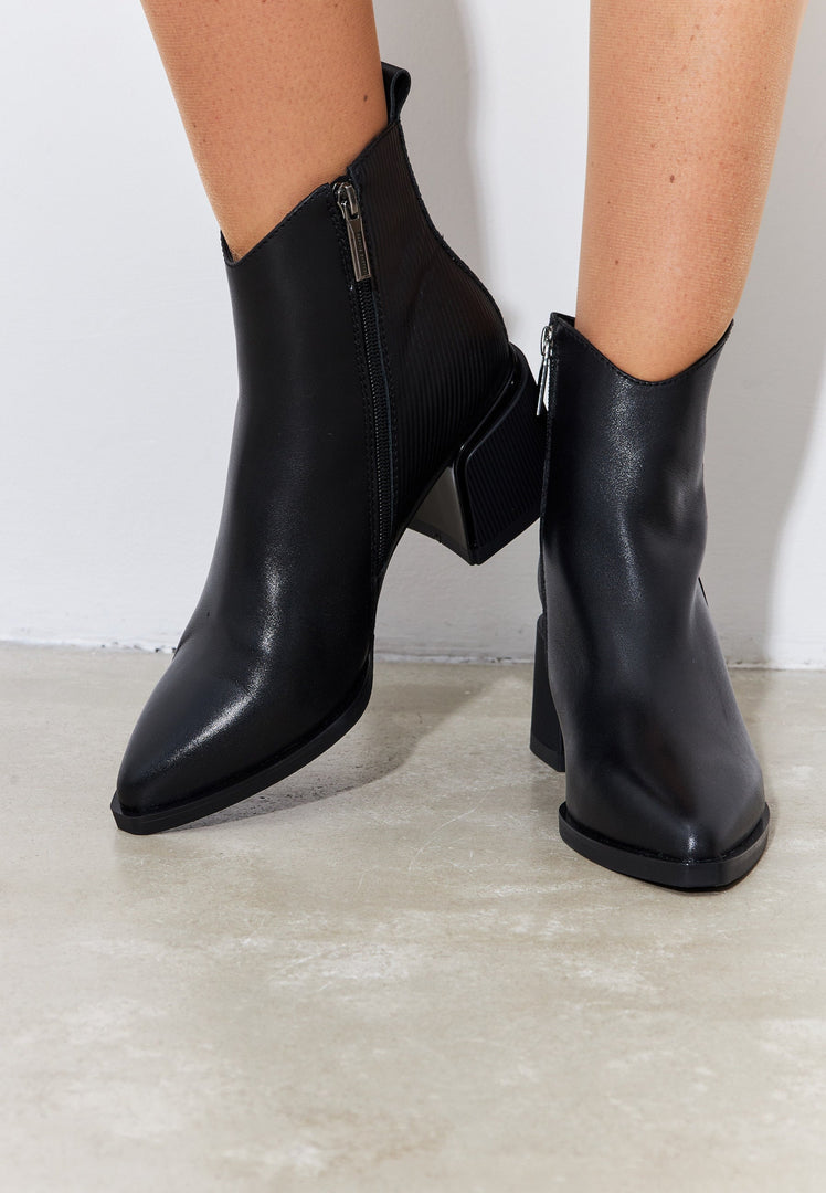 A stylish and affordable pair of women's black suede ankle boots, perfect for casual wear.