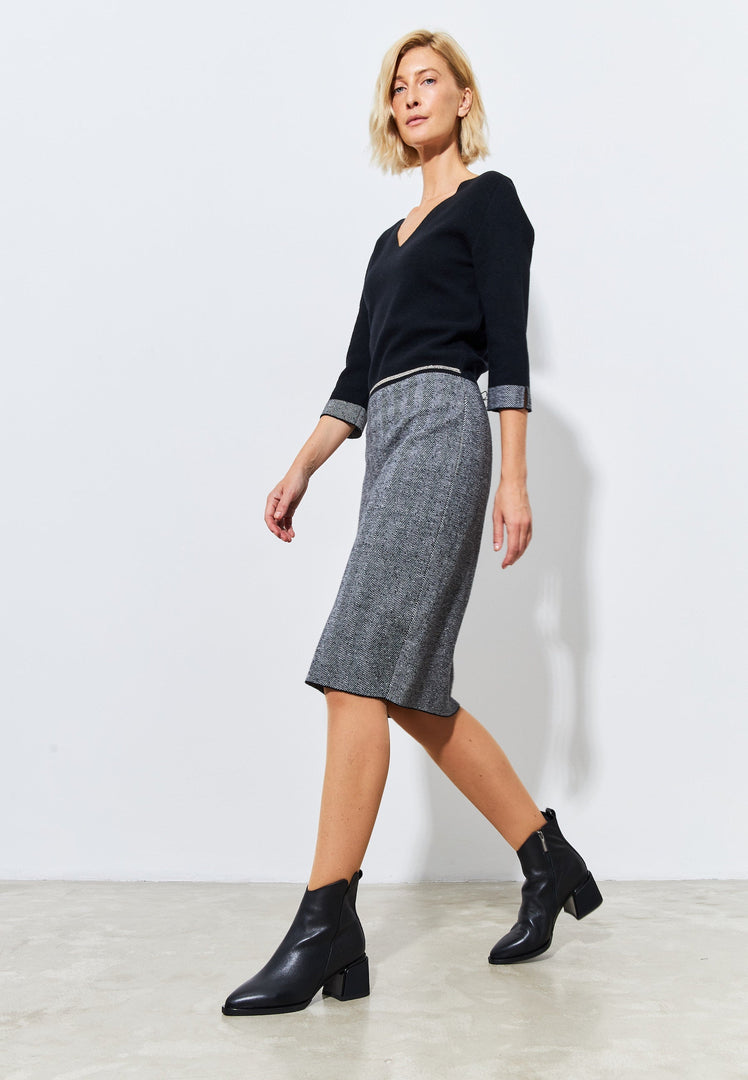 A stylish pair of affordable black suede ankle boots for women, ideal for casual wear.