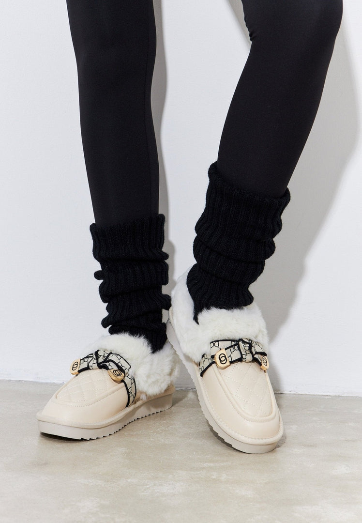 Stay cozy and stylish with these off white padded slip-on loafers, the perfect warm and comfortable shoes for any occasion.