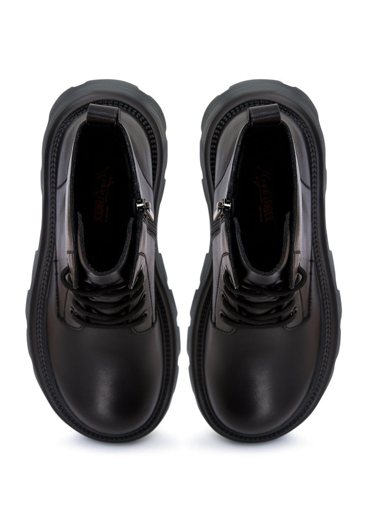 A pair of stylish leather lace-up booties, the epitome of luxe footwear and designer boots for those who appreciate high-end shoes.