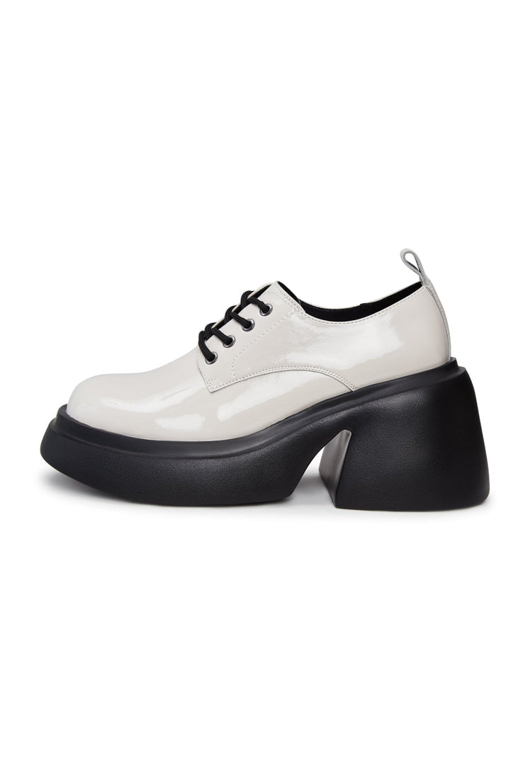 A stylish pair of white chunky loafers, perfect for adding a trendy touch to any outfit.