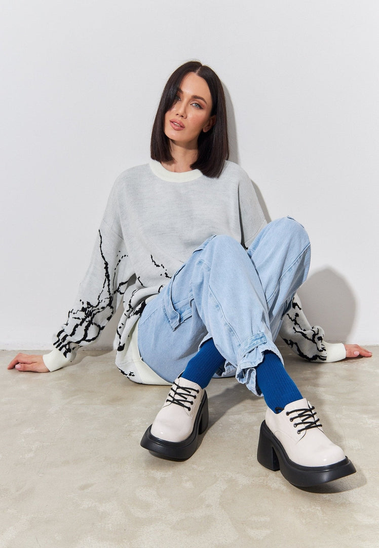 A trendy pair of chunky white loafers, a must-have fashion staple for women.