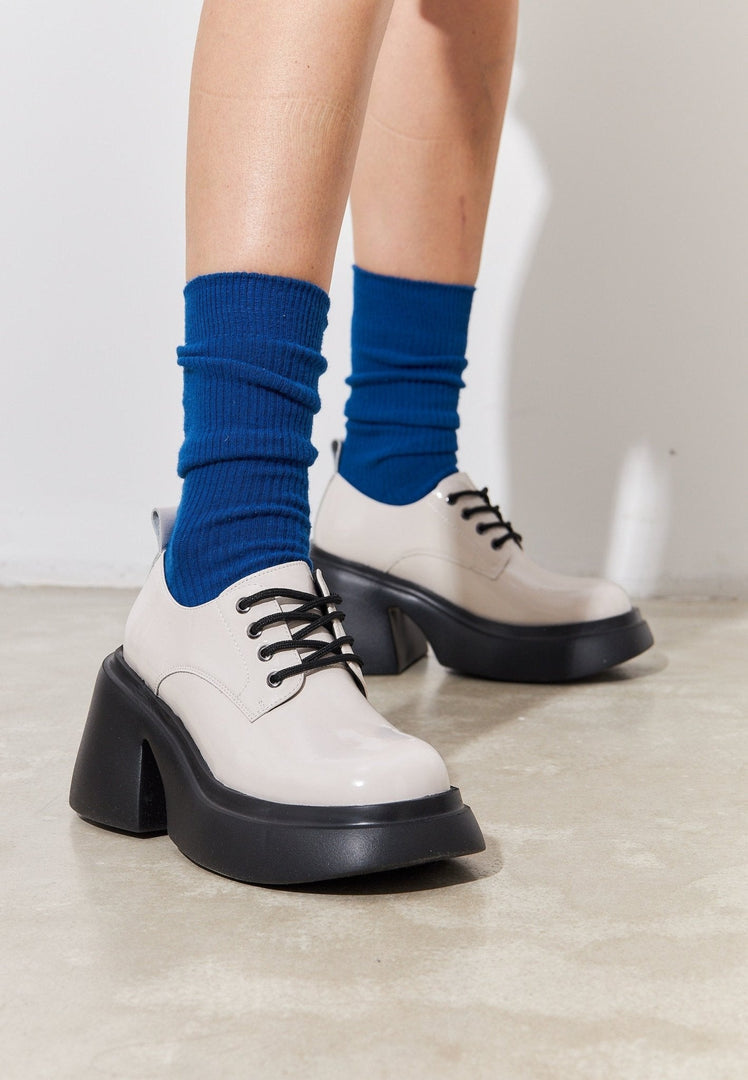 A stylish pair of white chunky loafers for women, the perfect fashion statement.