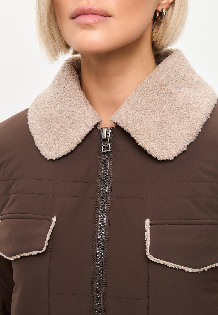 A trendy and stylish belted shearling coat with a long coat, perfect for winter fashion.