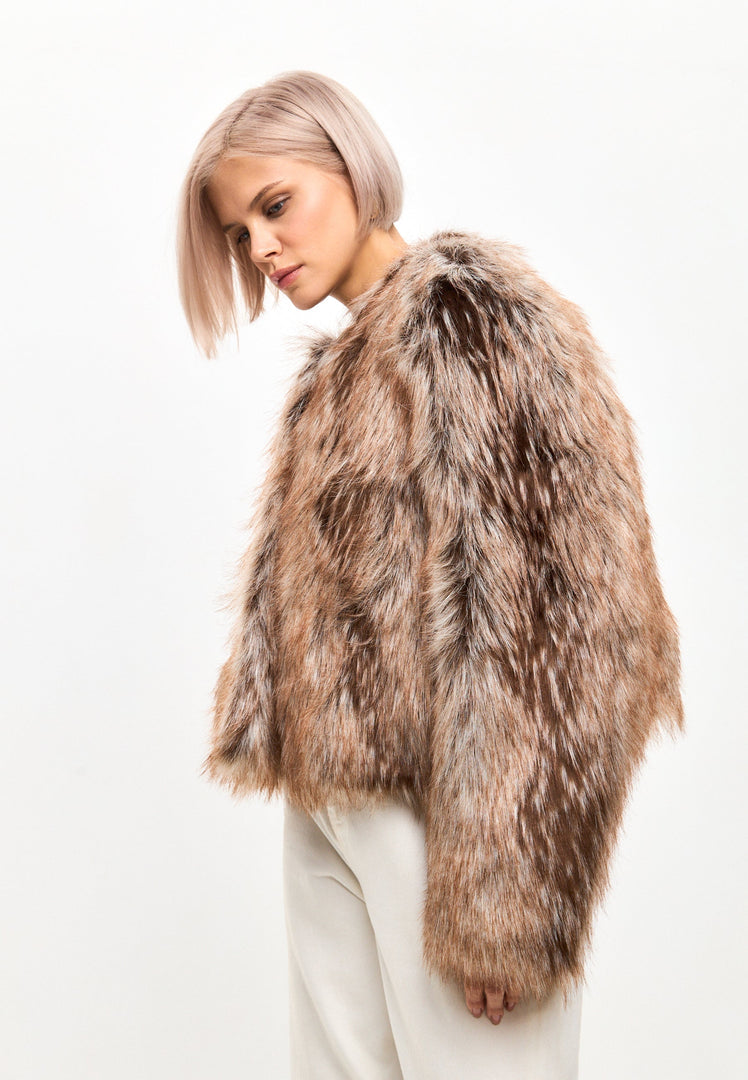 Stay cozy and stylish this winter with a luxe brown faux fur jacket - the perfect eco-friendly fashion choice for staying warm in the cold weather.