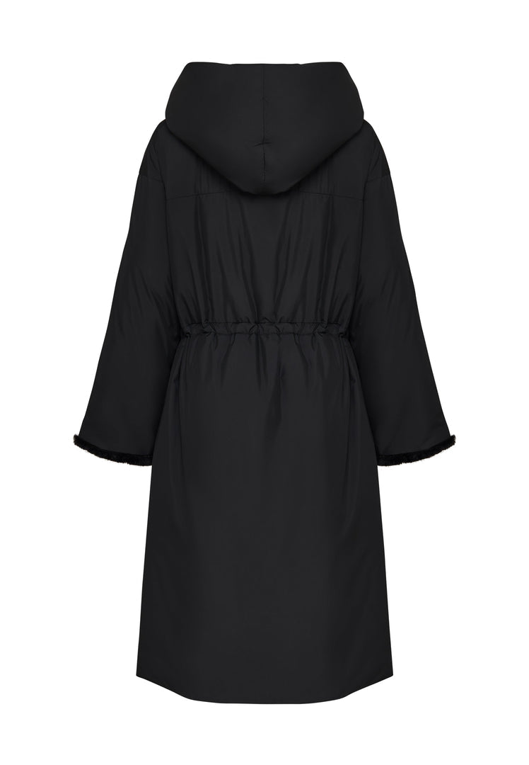 A stylish black oversized puffer coat with a hood and faux fur cuffs, perfect for winter. This plus size women's fashion jacket is an essential for staying warm and stylish.