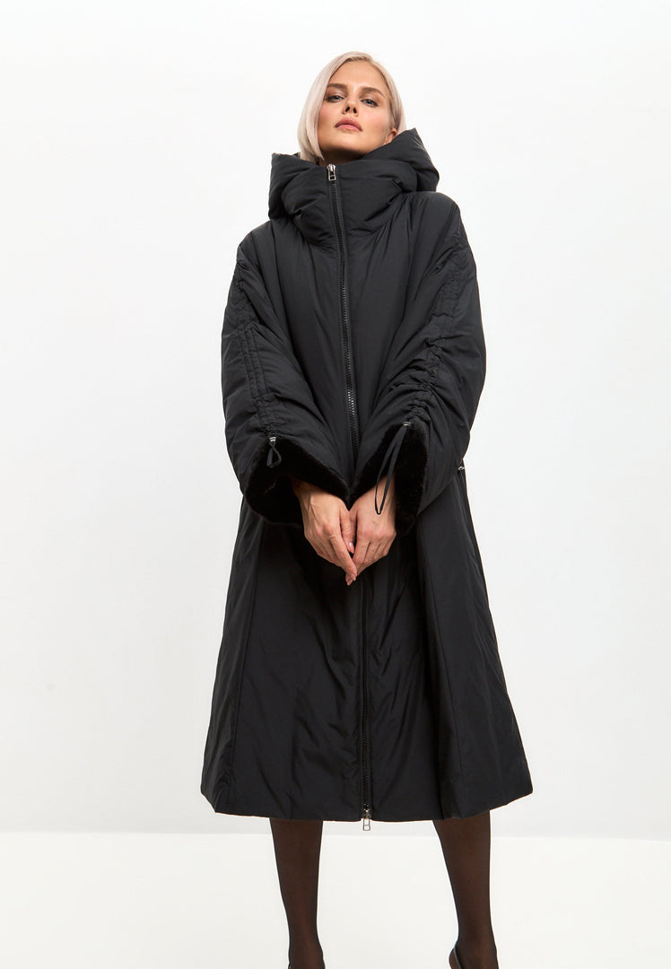 A stylish black oversized puffer coat with faux fur cuffs, perfect for winter, plus size outerwear for women's fashion.