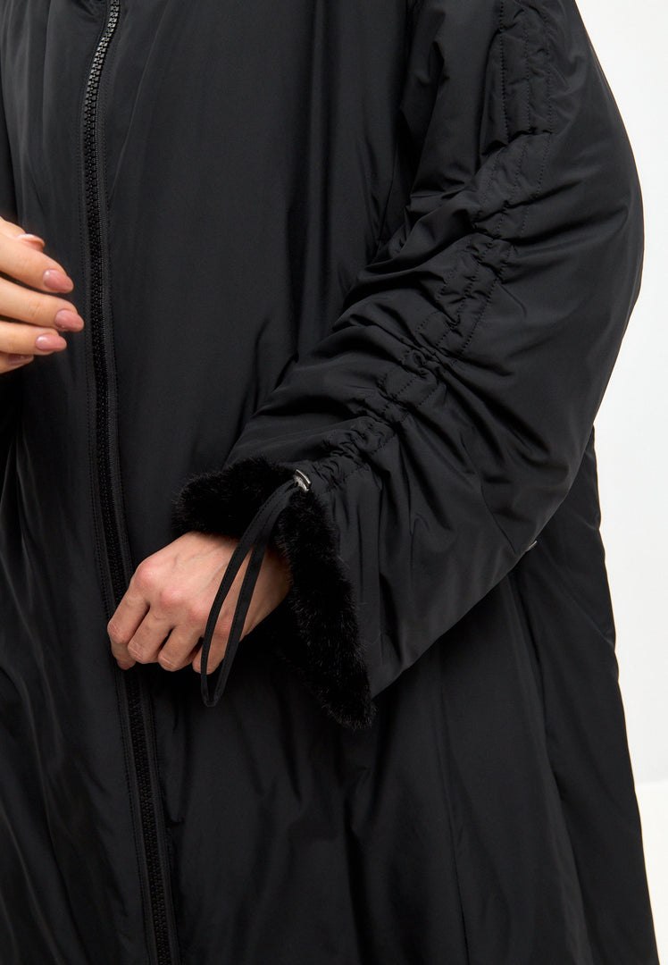 A stylish black oversized puffer coat with a hood and faux fur cuffs, perfect for plus size outerwear in women's fashion.