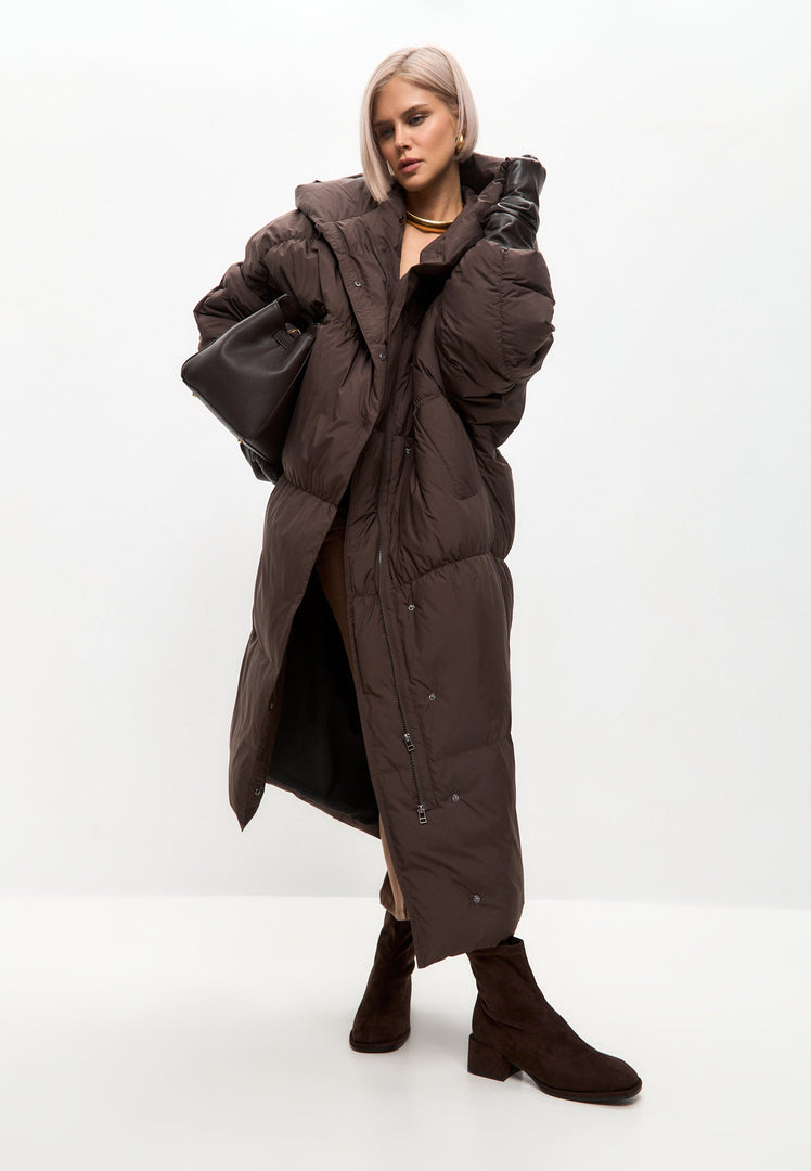 A fashionably cozy oversized puffer coat in a rich chocolate hue, perfect for the winter season.