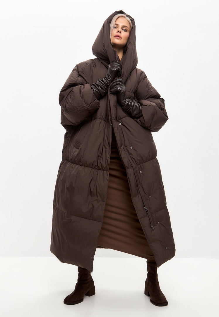 Stay cozy and stylish in this chocolate oversized puffer coat, perfect for winter. A must-have piece of oversized outerwear for the season, this plus size puffer coat will keep you warm and on-trend.