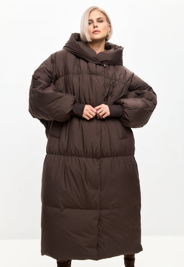Stay warm and stylish in this oversized chocolate puffer jacket, perfect for winter. Plus size outerwear that will keep you cozy all season long.