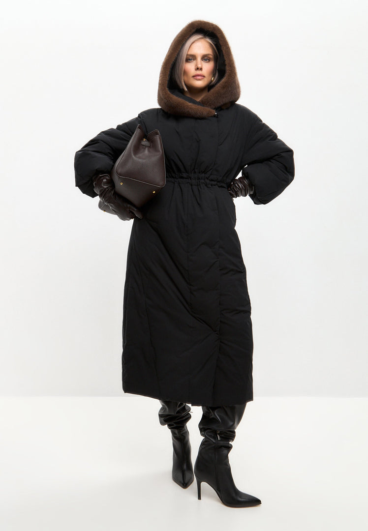 A stylish and luxurious hooded winter coat, perfect for the fashion-forward individual looking for high-end designer outerwear to stay warm and fashionable during the cold season.