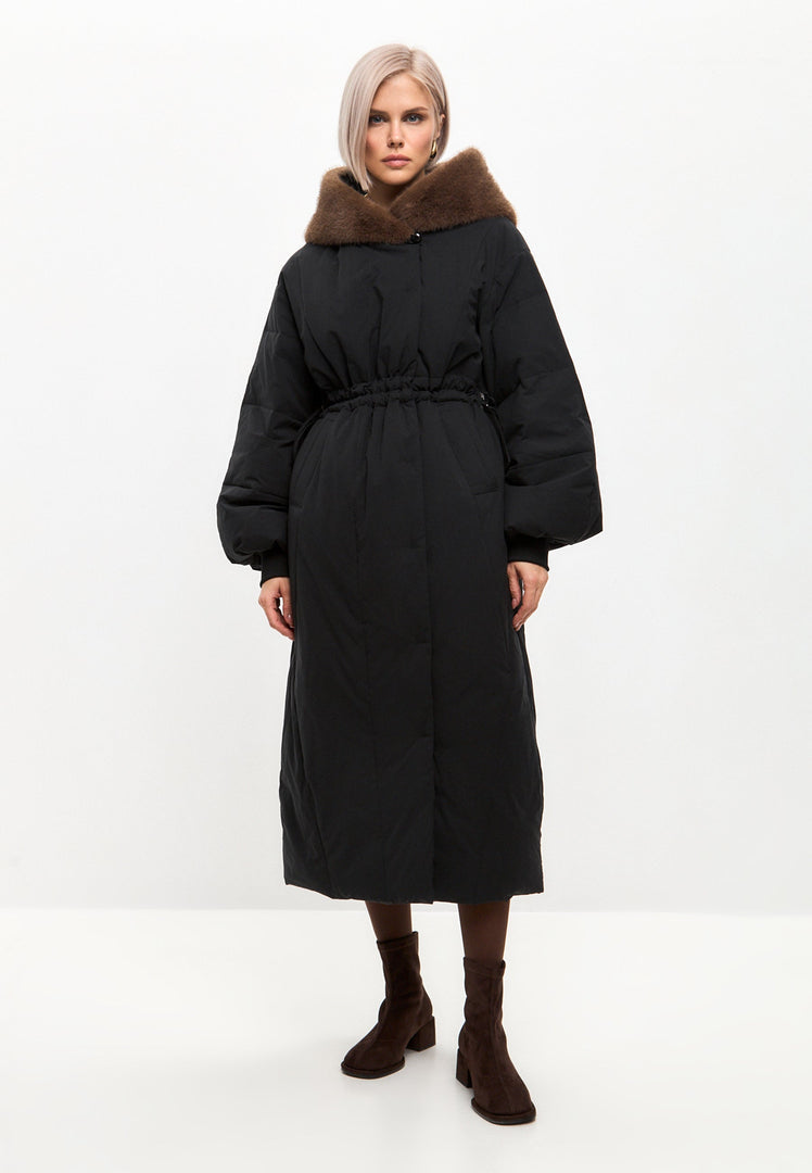 A stylish and luxurious hooded winter coat, perfect for staying warm in high-end designer outerwear this season.