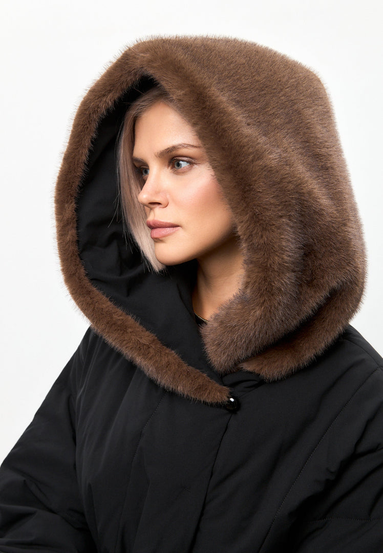 A stylish, luxury winter coat with a hood, perfect for staying warm and on-trend during the colder months.