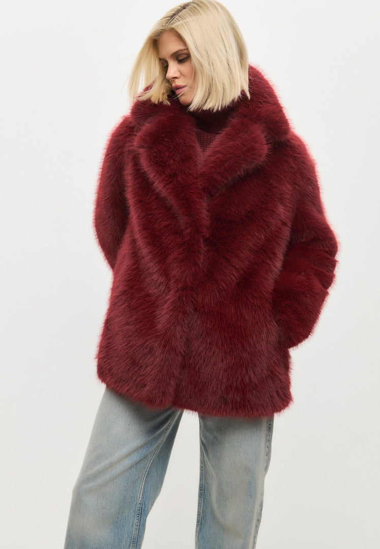 A chic red faux fur coat, perfect for winter fashion and women's outerwear.