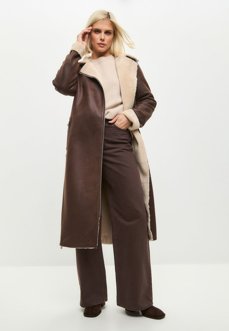 A stylish brown faux fur coat that can be reversed to a shearling exterior, making it a versatile long shearling jacket for women.