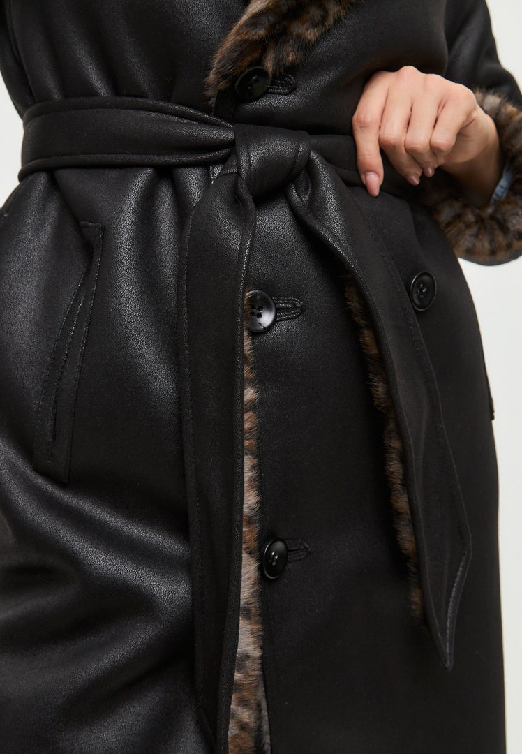 A stylish faux shearling and animal print reversible long coat, perfect for staying warm and fashionable in this shearling winter coat - the ultimate trendy winter outerwear.