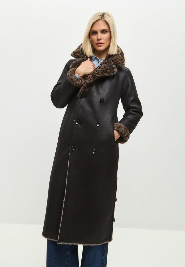 Stay stylish and cozy all winter long with this trendy reversible long faux shearling coat featuring a chic animal print design. Perfect for staying warm and on-trend this season.