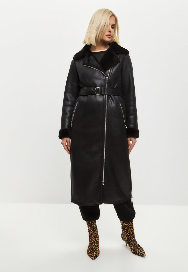 A stylish black shearling coat, reversible and cozy faux shearling jacket for women's winter outerwear. Stay warm and on-trend with this trendy shearling clothing essential.