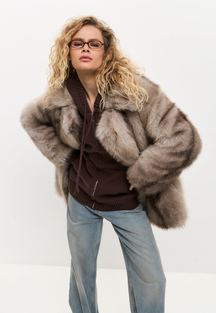 A stylish and luxurious brown faux fur coat, perfect for winter outerwear in women's fashion.