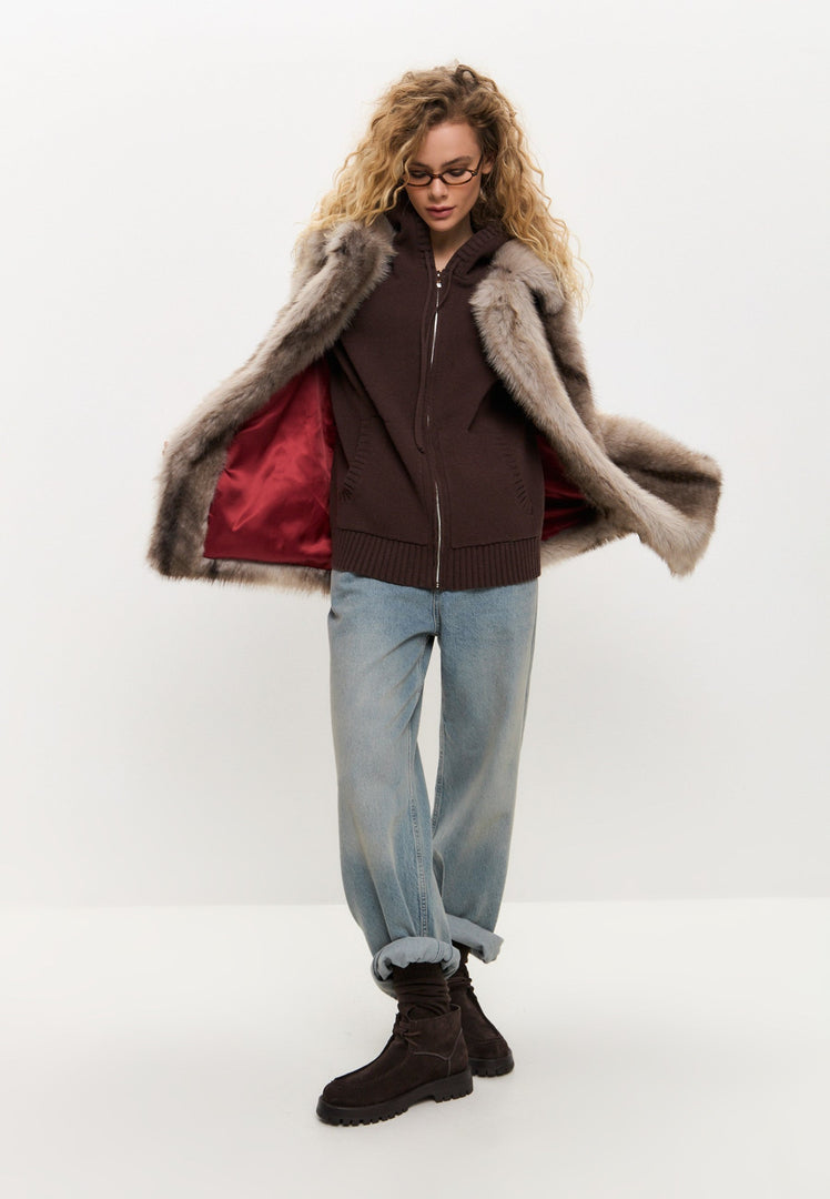 A stylish faux fur coat in luxurious brown, perfect for winter outerwear and women's fashion.